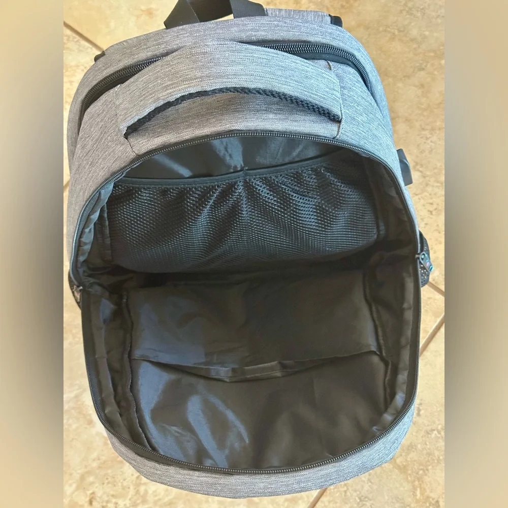 Backpack Excellent condition! Lots of zip compartments. Grey black. Clean!